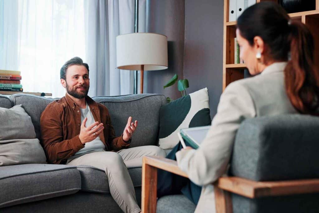 Individual participating in a one-on-one addiction counseling session with a licensed therapist.