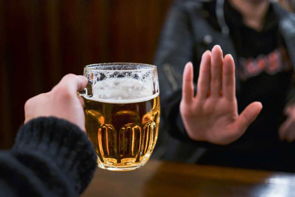Person refusing alcohol during alcohol withdrawal recovery