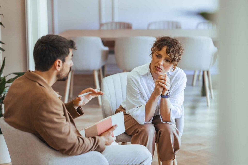 Clinician discussing a medically supervised benzodiazepine detox and taper plan with a patient.