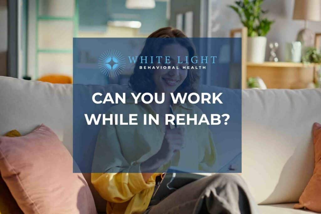 Woman working on laptop at home representing flexible rehab and IOP treatment