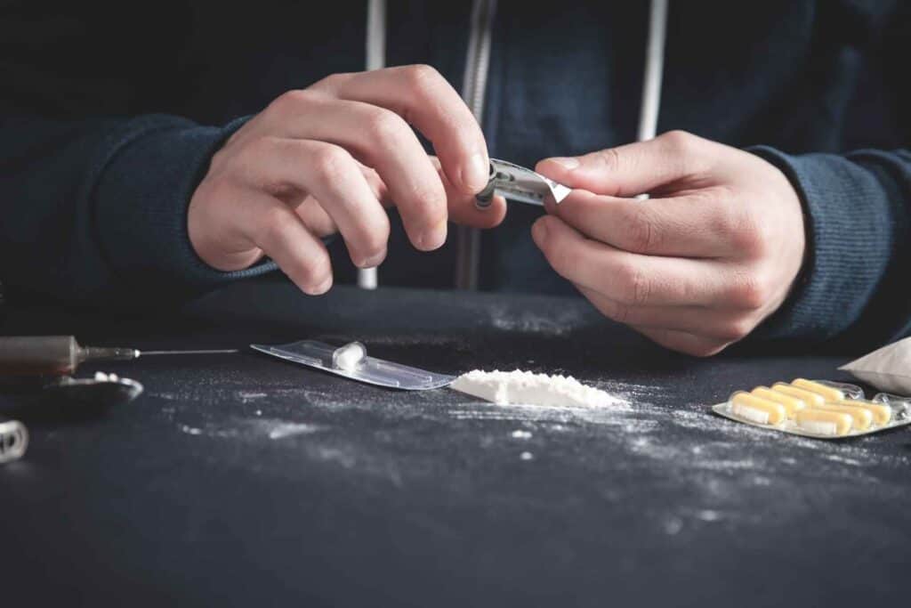 Cocaine and drug paraphernalia representing signs of cocaine addiction