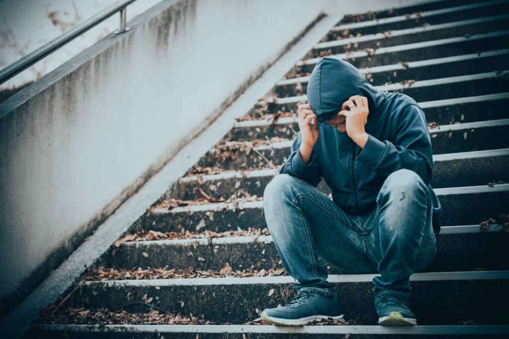Man experiencing emotional distress during cocaine withdrawal