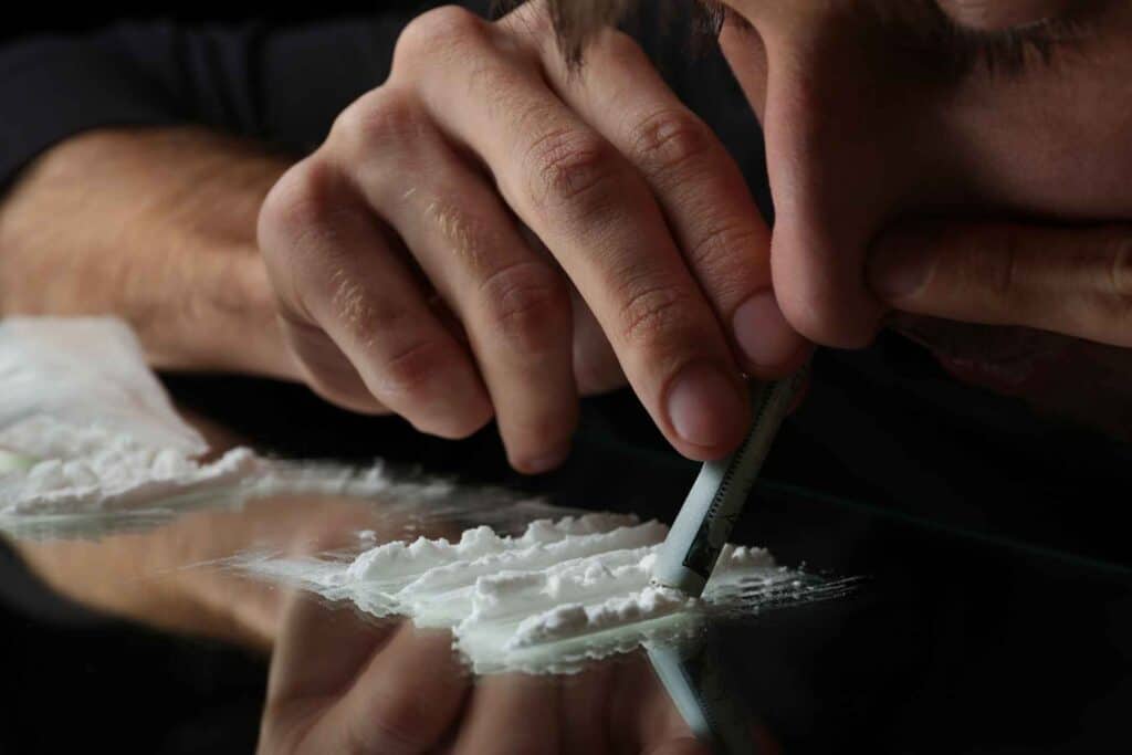 Cocaine Addiction Symptoms 1 Person using cocaine showing signs of cocaine addiction