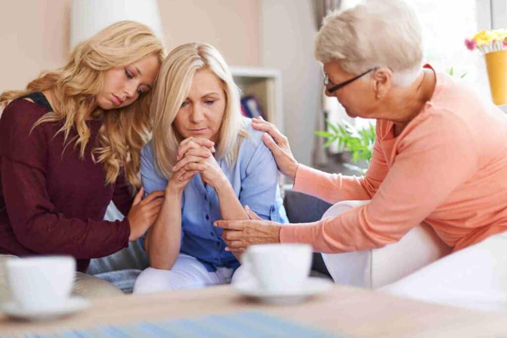 Family Therapy For Addiction Recovery 1 Family members comforting a loved one during a difficult conversation about addiction recovery and seeking treatment.