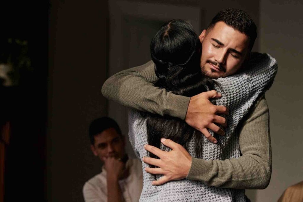 What Is Medical Detox? 1 Man embracing another person during emotional support in addiction recovery