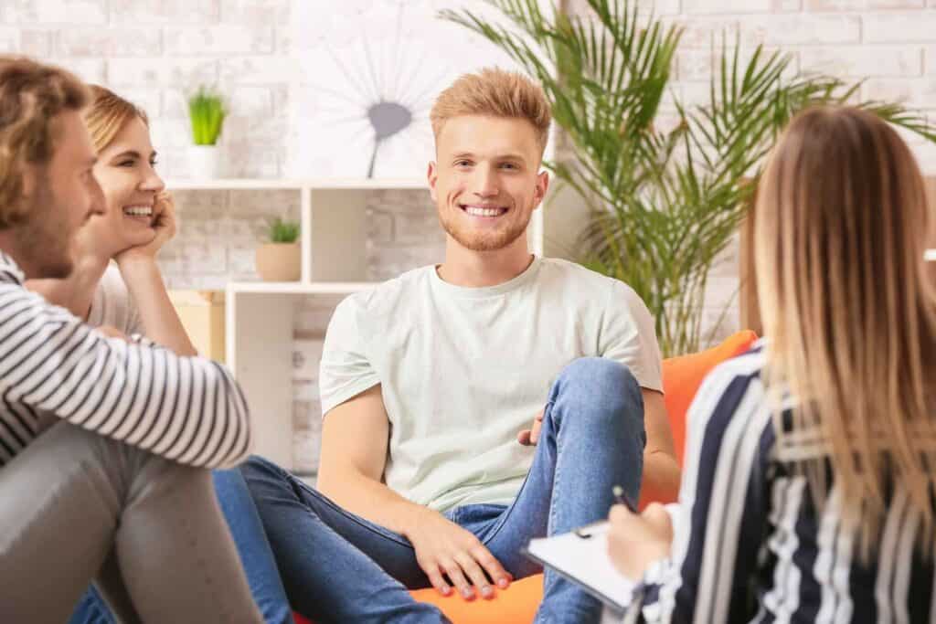 Methamphetamine Detox 1 Adults participating in a supportive group addiction treatment session.