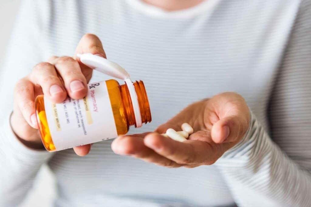 Prescription Drug Detox 1 Person taking prescription medication while preparing for medically supervised prescription drug detox.