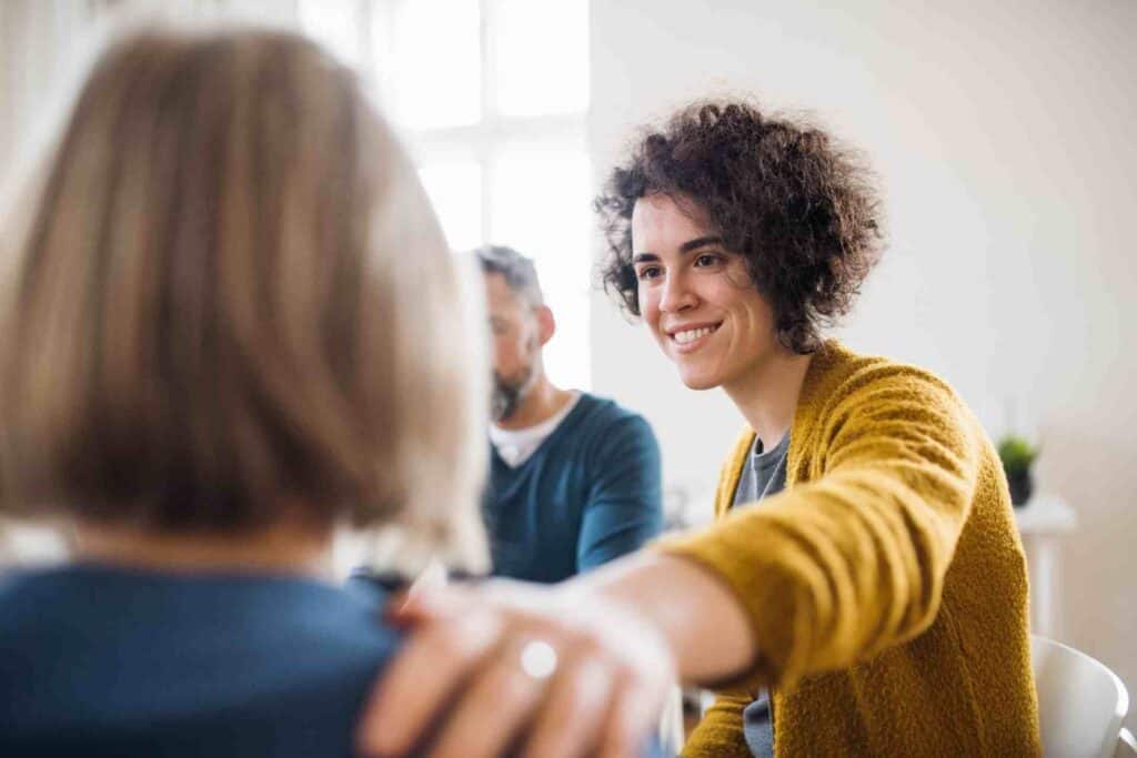 Therapist providing emotional support during medical detox counseling session
