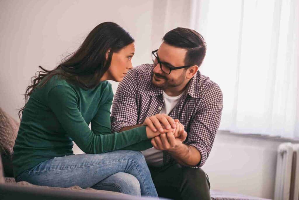 A therapist providing emotional support to a client during a Dialectical Behavior Therapy (DBT) counseling session.
