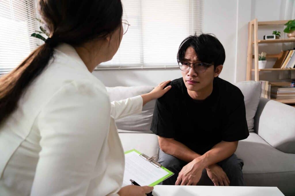 Xanax Withdrawal Symptoms 1 Therapist providing emotional support to a client during a Xanax withdrawal counseling session.